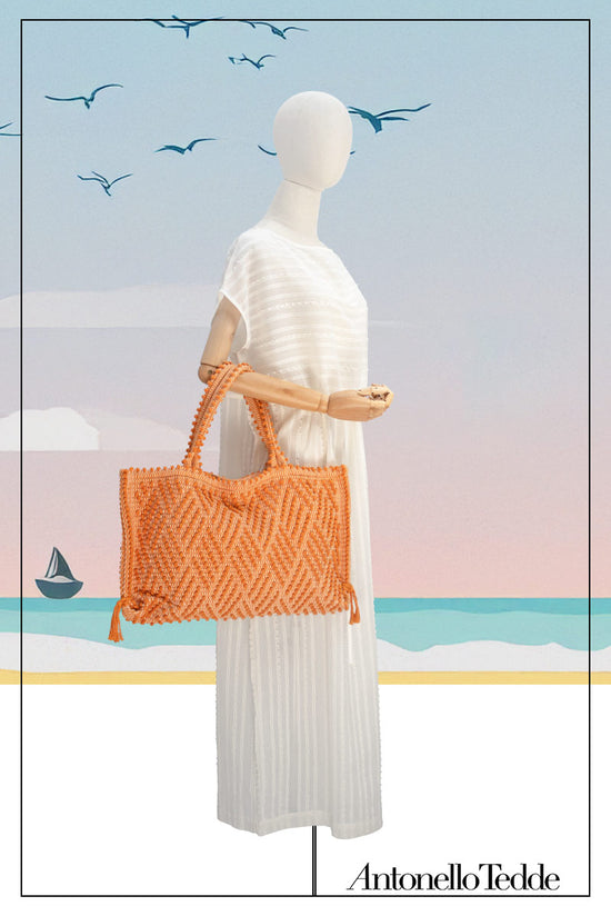 Medium tote bag orange with diamond pattern on a model for proportions it is a winter or summer bag - luxury handbag - handwoven tote made in Italy by hand • timeless individualistic fashion • eco-friendly fashion • socially responsible, lasting fashion