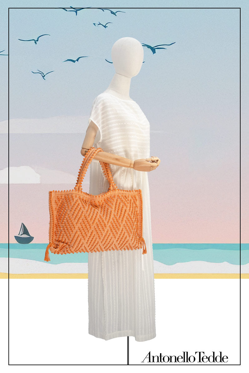 Capriccioli Medium orange with zig zag pattern - The bag is made using authentic Sardinian hand weaving methods in ethically managed factories. This tote bag is extraordinary and evokes faraway cultures with a contemporary touch, with focus on details such as colour, and material that are sustainable and eco-conscious