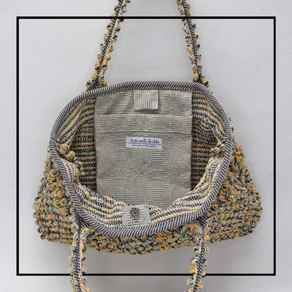 Inside and pocket view of  tote with gathered top and melange multicoloured yarn The best eco luxury bags and accessories brand. Stylish clothes and Eco-Friendly with recycled yarns